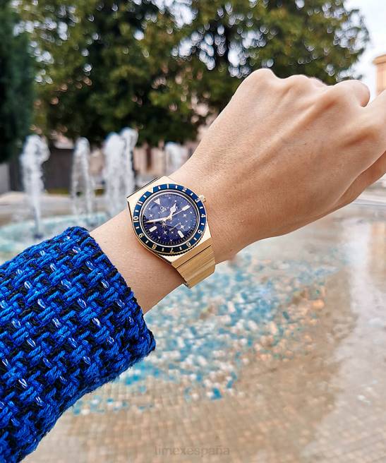 relojes | Q Timex reloj celestial de 36 mm con correa de expansión de acero inoxidable tono dorado/azul mujer Z8X2328